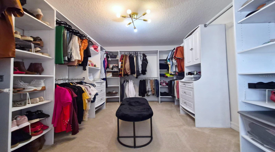 Large Walk-In Closet with stylish and functional storage solutions.