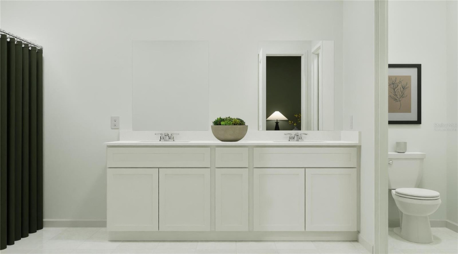 Virtually staged. Main bathroom suite