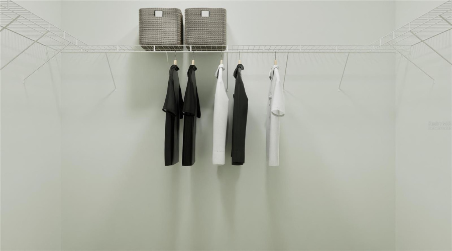 Virtually staged. Walk in closet for Main bedroom