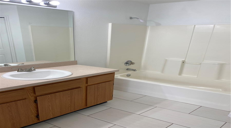 Primary suite bathroom. Also has a walk-in closet