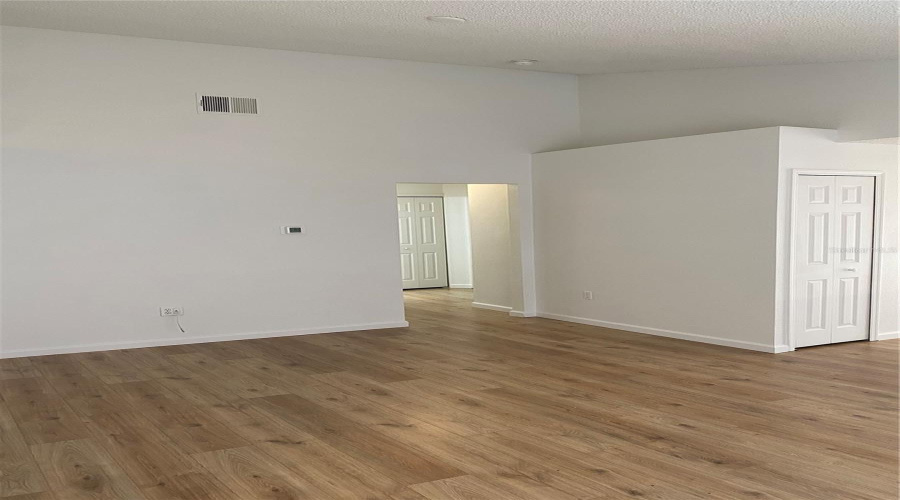 Hallway entrance to garage, additional bedrooms and 2nd bathroom