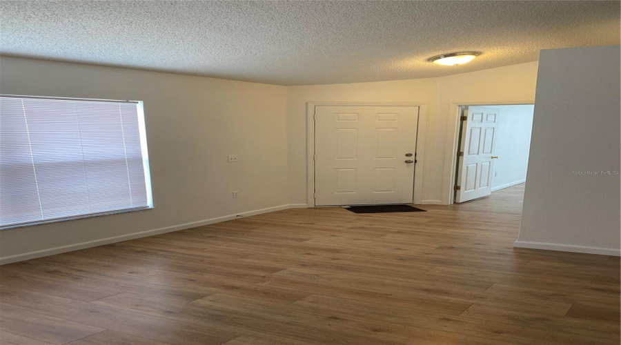 Entry with primary suite to the right looking at the front door