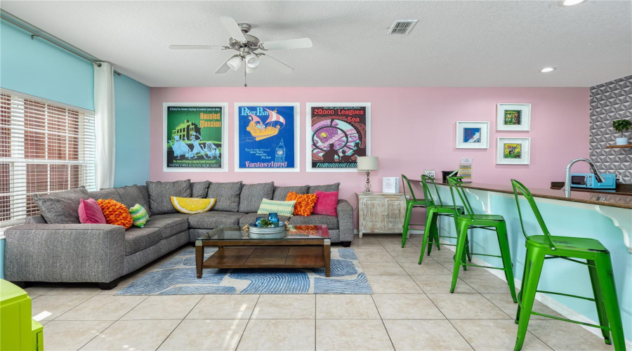 Fun bright vacation themed breakfast bar and TV room.