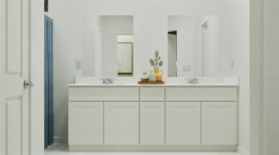 Virtually staged. Main bathroom suite