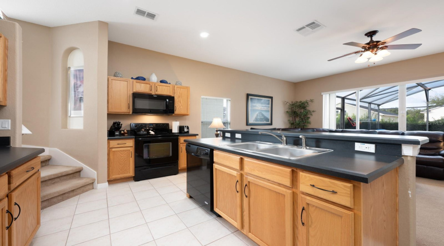 Whether you're cooking, baking, or entertaining, the spacious Kitchen is a welcoming hub for gathering with family and friends.