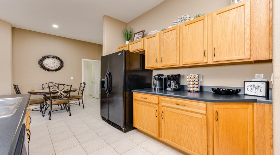The spacious Kitchen is as functional as it is beautiful with abundant cabinetry, a breakfast bar, walk-in pantry, and modern appliances—everything you need for effortless everyday living.