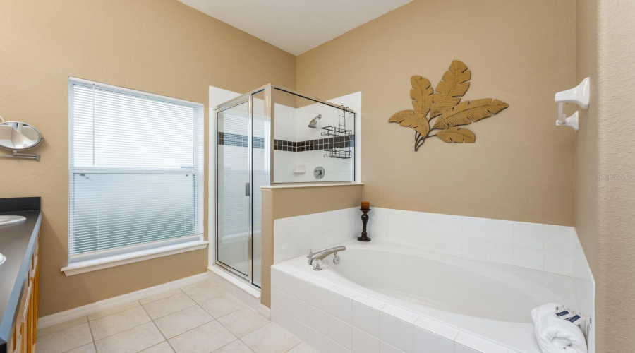 End your day with a soothing soak in the garden tub, nestled in the comfort of the private en suite.