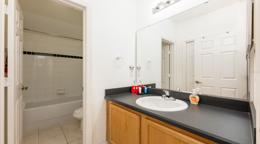 A full guest Bathroom is accessible from Bedroom 2, as well as the hallway.