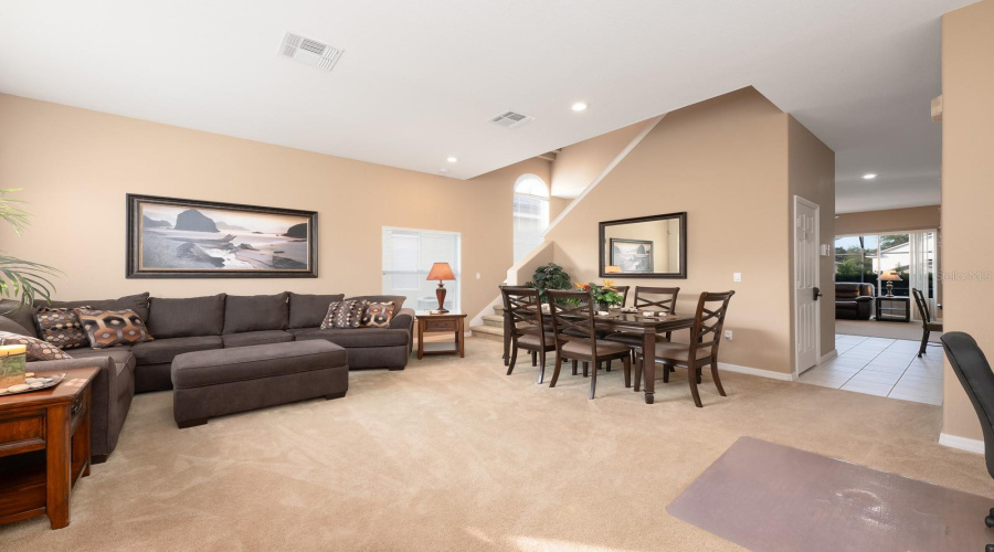 A welcoming paver driveway sets the tone as you step inside to a bright Living Room/Dining Room combination, ideal for relaxing or entertaining.