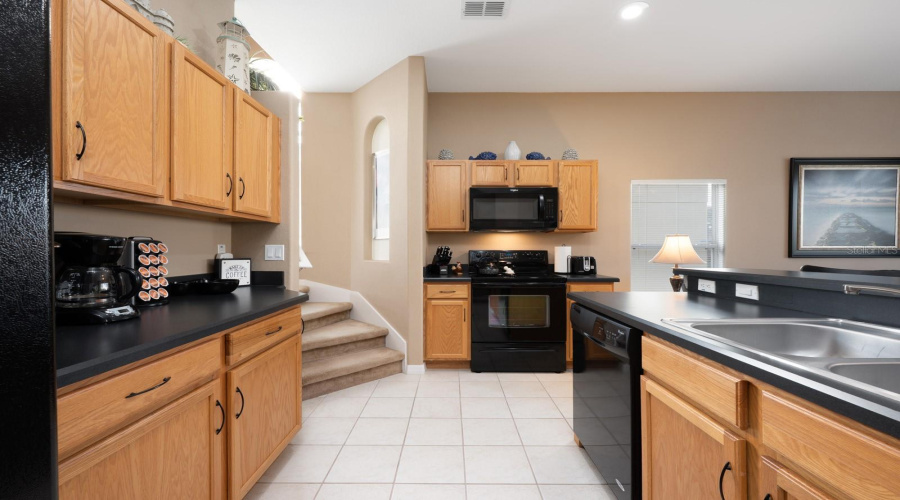 At the heart of the home is the open Kitchen, thoughtfully designed with ample cabinetry and generous counter space.