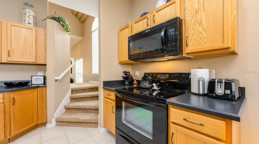 Stairs to the 2nd floor are accessible from the Living/Dining area, as well as from the Kitchen.