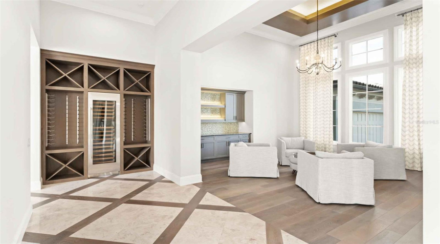 Conversation area/formal dining room with serving bar..