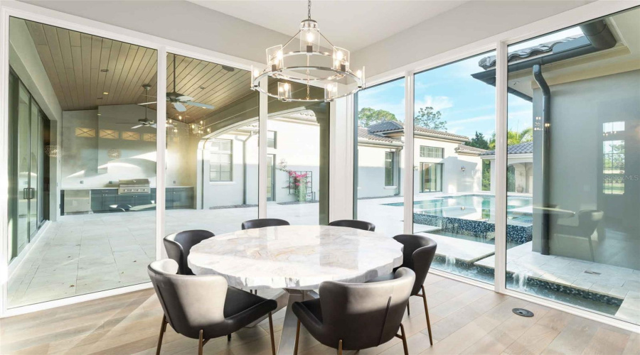Loads of natural light flood the space from these gorgeous near floor to ceiling windows..