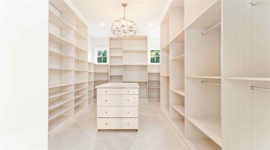 Dual dressing rooms, one with second laundry room for primary..