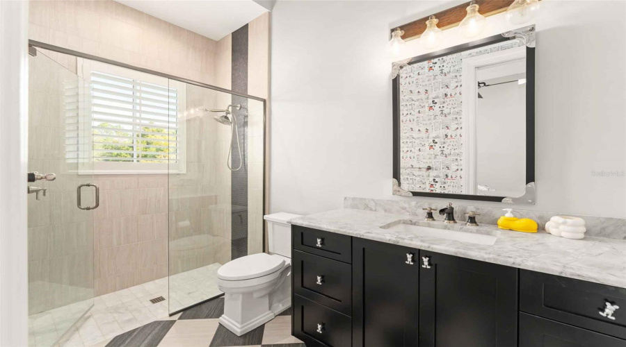 Modern Mickey themed bath.. look at the pulls!