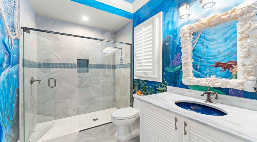 With beautiful, custom Little mermaid mural and theming..