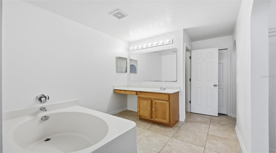 Master BATHROOM- with 2 separate his and hers walk in closets