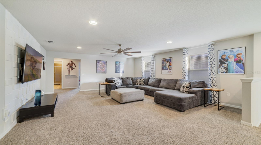 Upstairs, a SPACIOUS LOFT provides an additional lounge or TV area—perfect for guests.