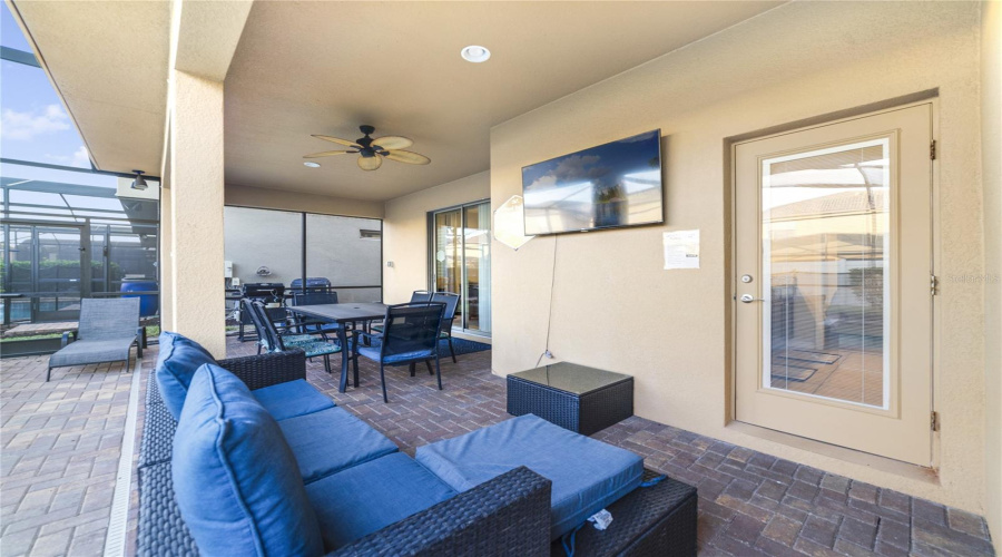 Sliders open to the covered patio, leading you to your private outdoor oasis.