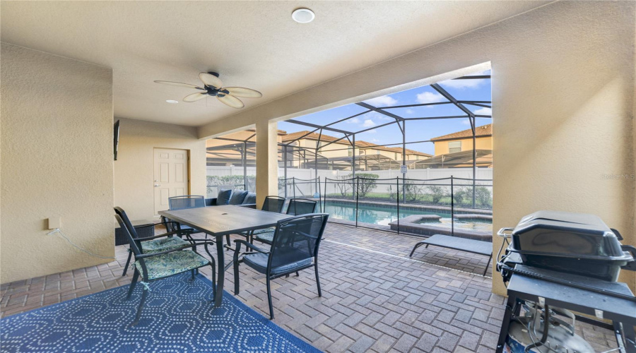With a remote-controlled pool heater, PAVER-STONE DECKING, and plenty of room for relaxing or dining al fresco, this is Florida living at its finest.