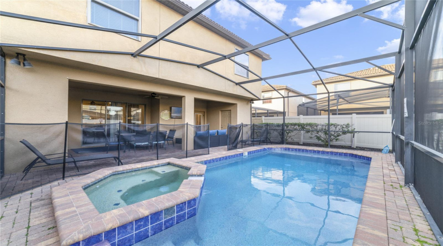 Unwind in your private heated pool and spa, surrounded by a screened lanai that blends Florida outdoor living with comfort and privacy.