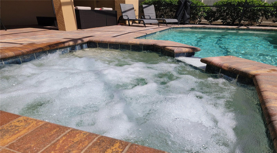 Unwind in your private heated pool and spa, surrounded by a screened lanai that blends Florida outdoor living with comfort and privacy.