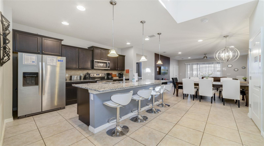 The Kitchen center island includes space for counter-height seating, perfect for casual dining or conversation.