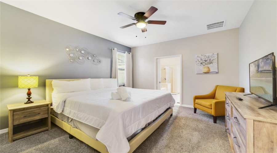 The first floor features one of TWO PRIMARY SUITES, complete with a walk-in closet and a SPA-INSPIRED EN SUITE BATH.