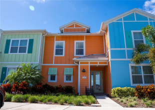 Vibrant Margaritaville Resort townhouse in Kissimmee — tropical-style exterior, lush landscaping, and prime location just minutes from Disney and Sunset Walk.