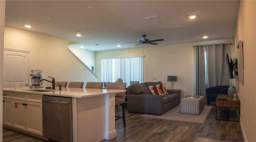 Bright open-concept layout with spacious living area, modern kitchen, and seamless flow — ideal for entertaining or relaxing after a day at the parks.
