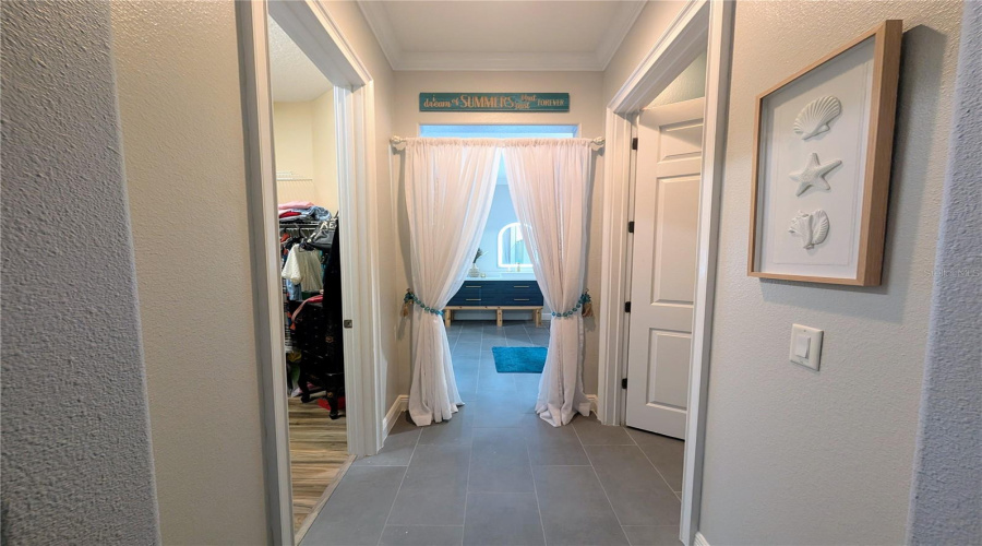 hall into ensuite leads through private water closet