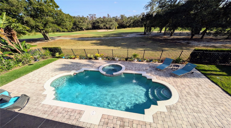 pool with spouts and spa. $5000 credit for new heater