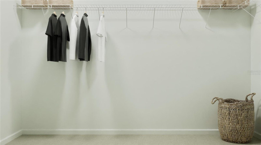 Virtually staged. Main bedroom walk in closet