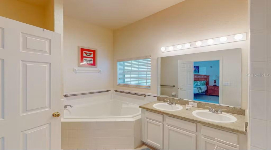 Primary Bathroom with dual sinks, garden tub and walk in shower