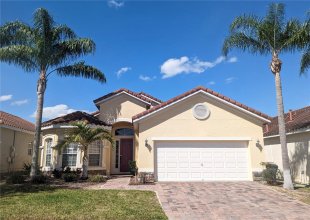 Front of the home with paved driveway for two vehicles