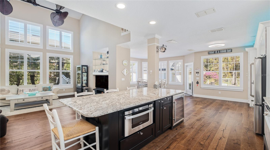 View from Kitchen into Eat In Kitchen Area and Family Room and Sun Room