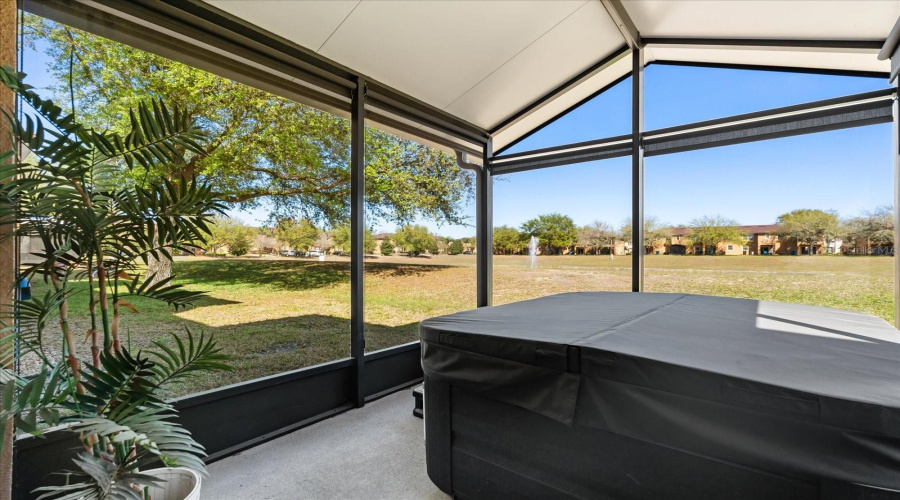 NEW EXPANDED SCREENED IN COVERED PATIO WITH SPA AND WATER VIEW