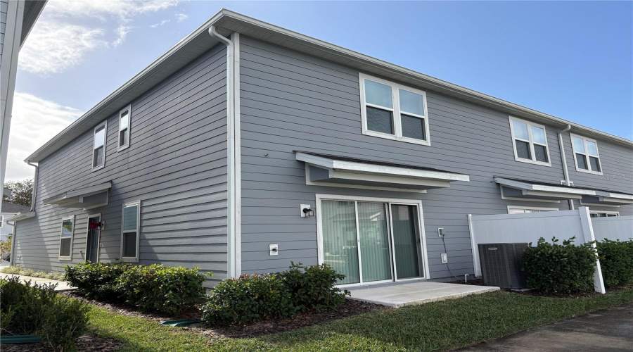 View of Front Door/balcony from pond sidewalk