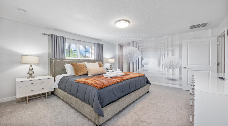 Upstairs, the Primary Suite serves as a tranquil escape with a STRIKING ACCENT WALL, built-in closet, and a well-appointed EN SUITE BATH.