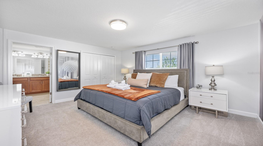 Upstairs, the Primary Suite serves as a tranquil escape with a STRIKING ACCENT WALL, built-in closet, and a well-appointed EN SUITE BATH.