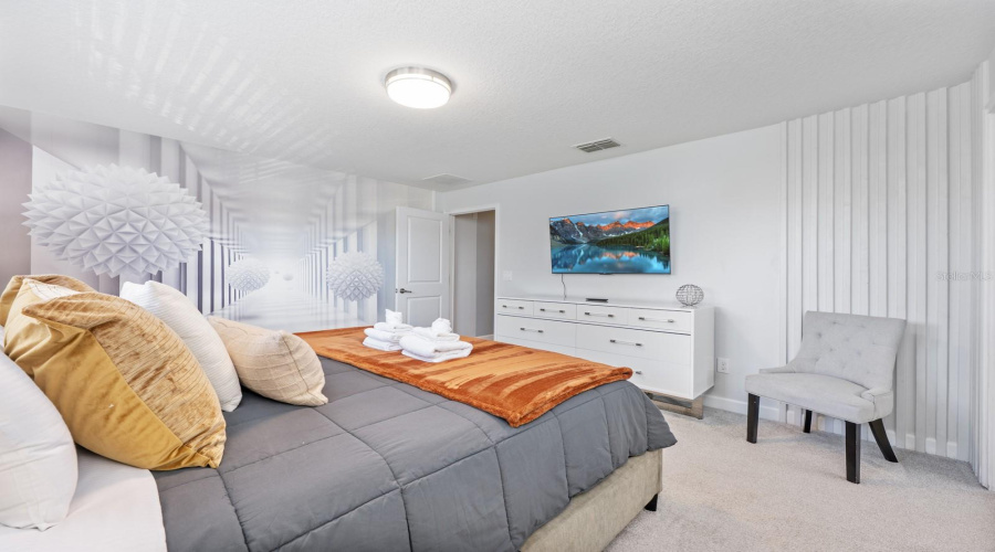 Upstairs, the Primary Suite serves as a tranquil escape with a STRIKING ACCENT WALL, built-in closet, and a well-appointed EN SUITE BATH.