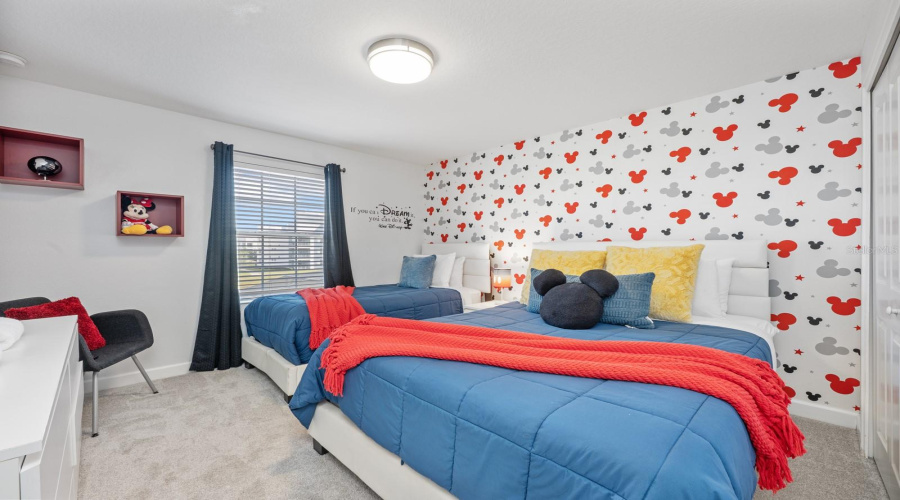 Two additional CARPETED bedrooms—one thoughtfully decorated with a Disney theme and the other with a sports theme add excitement and fun. Bedroom 4