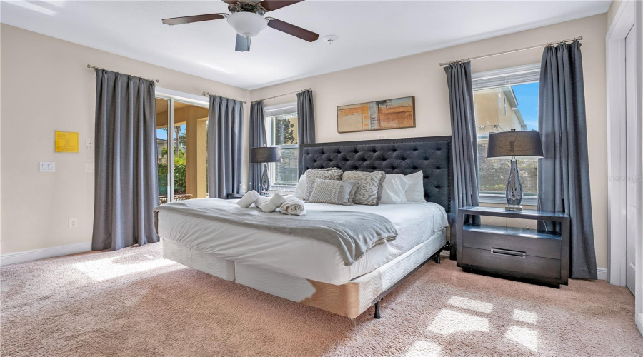 Downstairs Primary Suite with access to the pool/lanai