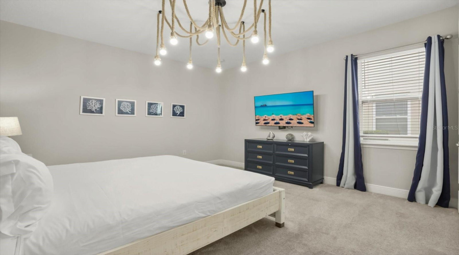 Upstairs primary suite with private en suite bath.