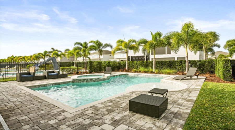 Large heated pool and Jacuzzi under the Florida sun.