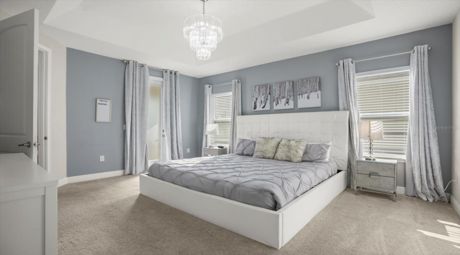 Luxurious primary suite with premium furnishings.