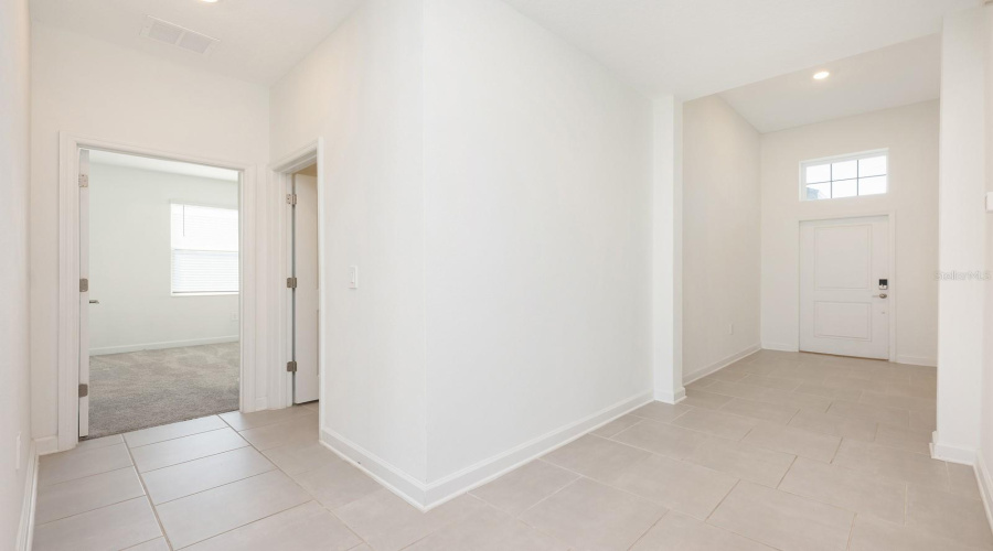 Built in 2023 and impeccably maintained, the home sits gracefully on a CORNER LOT with no front neighbors, showcasing serene CONSERVATION VIEWS and a peaceful, upscale setting.