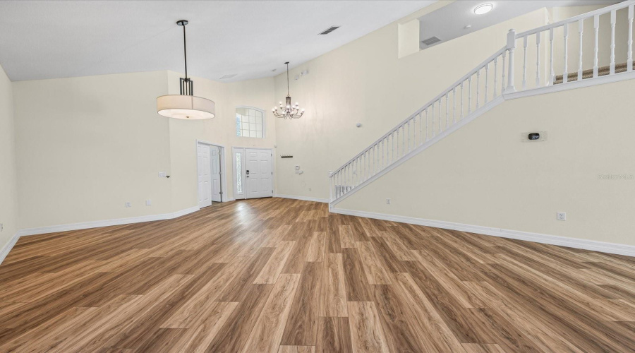 Living room with view of the foyer and stairway