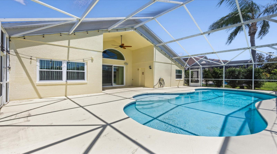 Screened in pool area with water view
