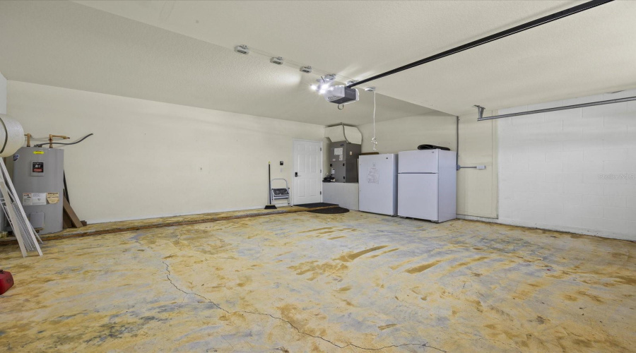 Garage for two vehicles with plug for electric vehicle charging